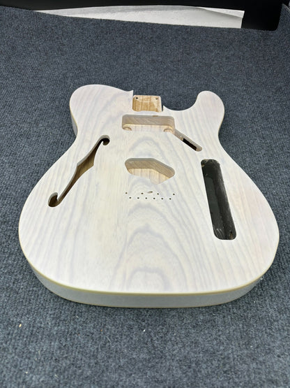 The semi-hollow body of TL electric guitar is 55.9mm wide and 17mm deep, with standard brass bridge and customized circuit.