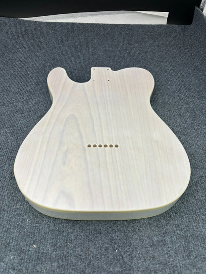 The semi-hollow body of TL electric guitar is 55.9mm wide and 17mm deep, with standard brass bridge and customized circuit.