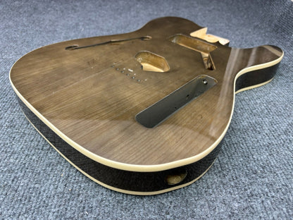 The semi-hollow body of TL electric guitar is 55.9mm wide and 17mm deep, with standard brass bridge and customized circuit.